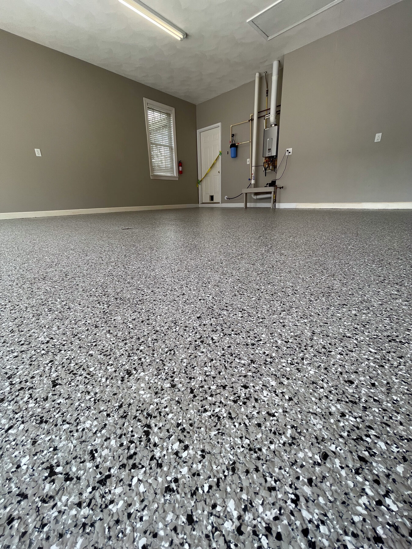 Clean gray vinyl flake garage floor installation