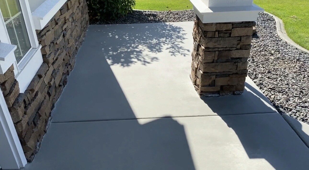 Completed sealed concrete front porch