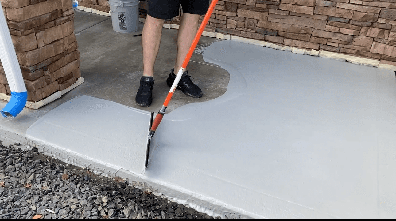 Concrete repair and seal coat application in progress