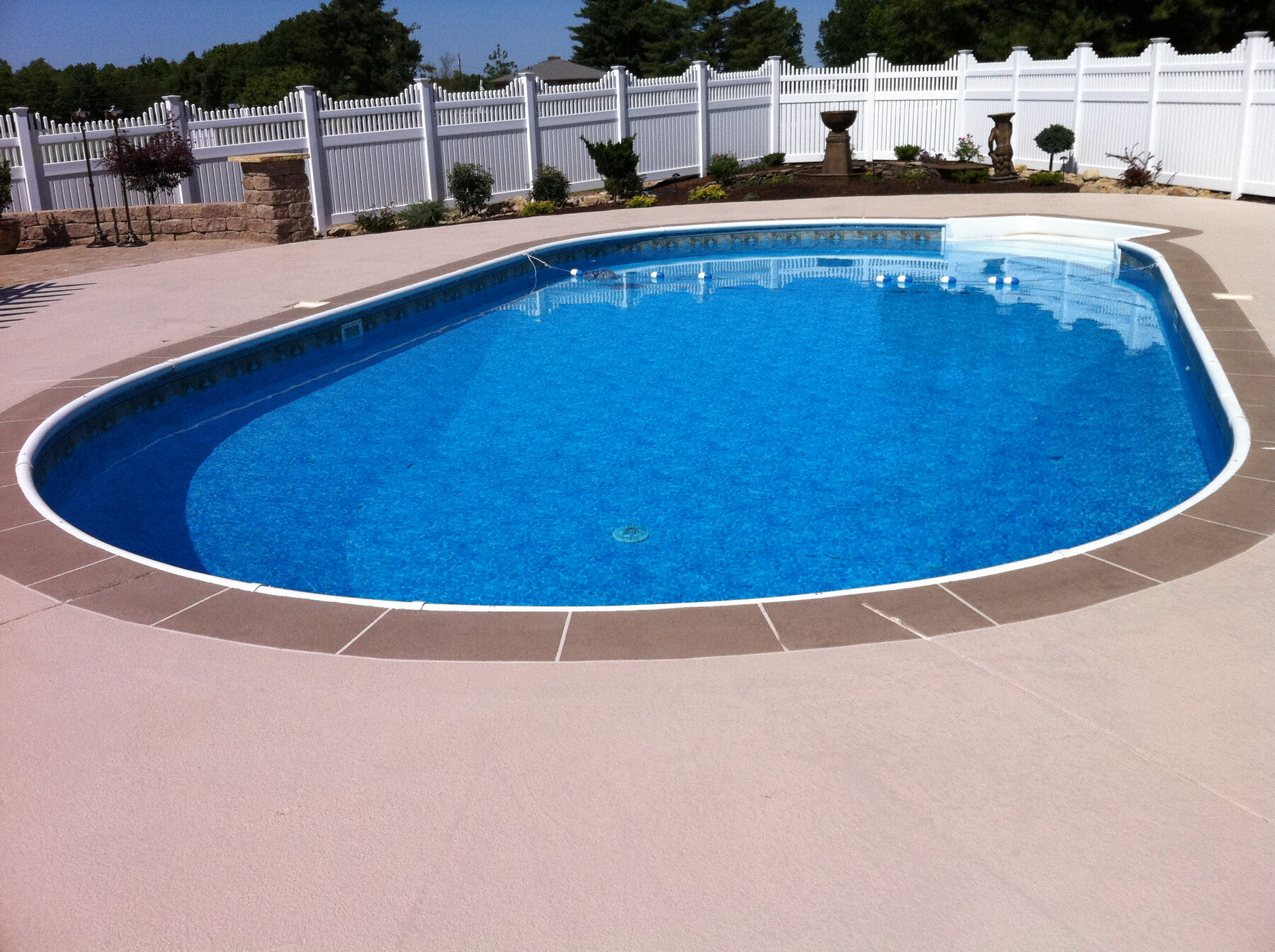 Finished sealed concrete pool deck
