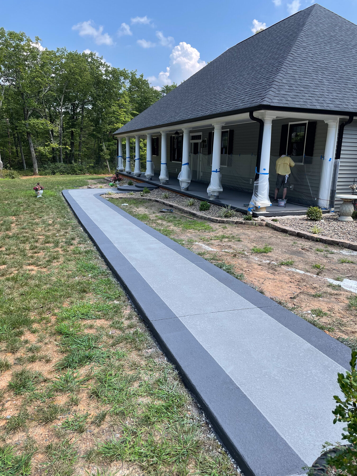 Finished two-tone concrete walkway and porch seal coat
