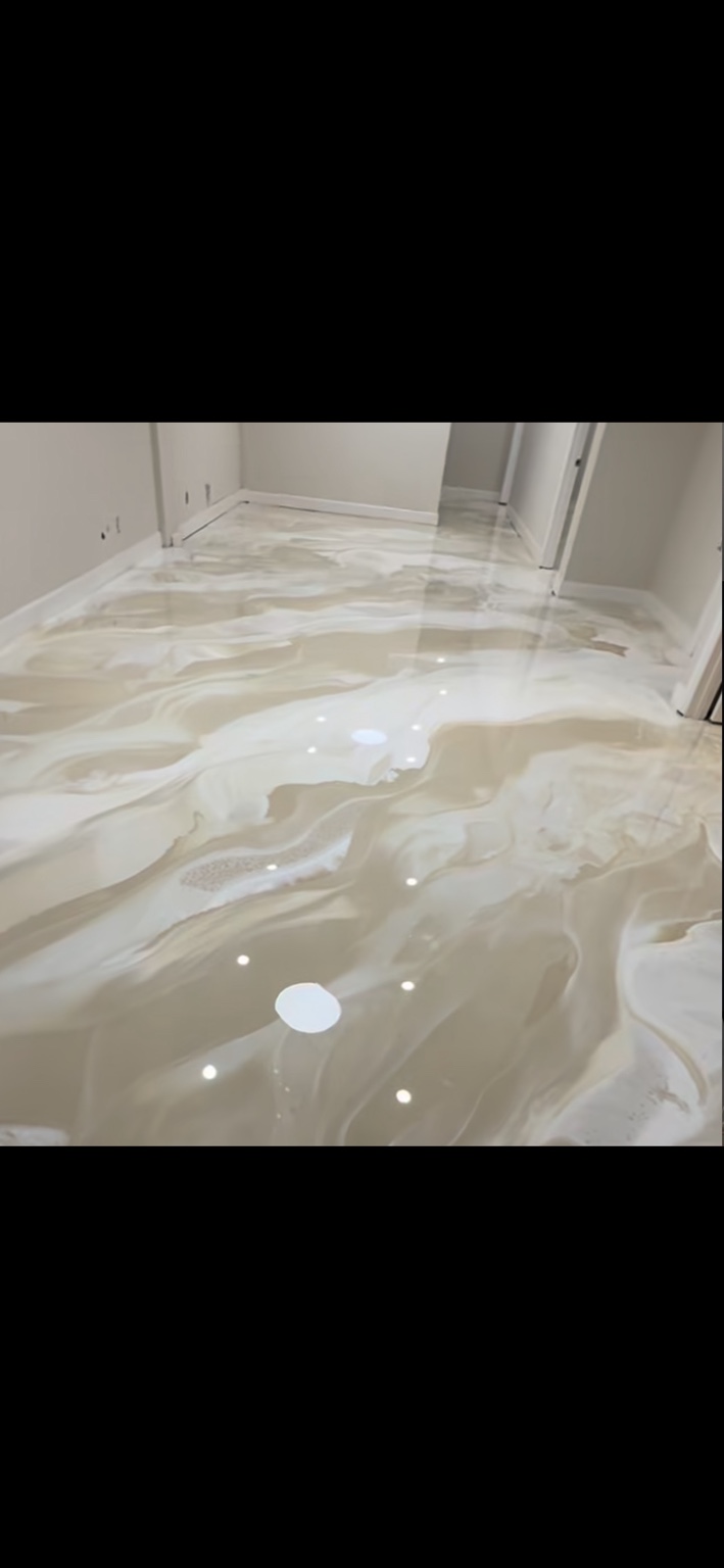 Warm white and beige metallic epoxy floor with flowing movement
